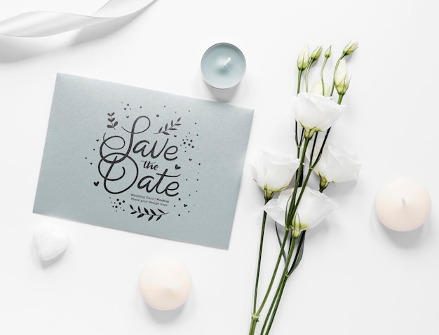 top view of wedding card with roses and candles