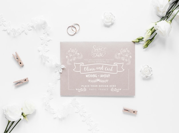 PSD top view of wedding card with roses and clothing pins