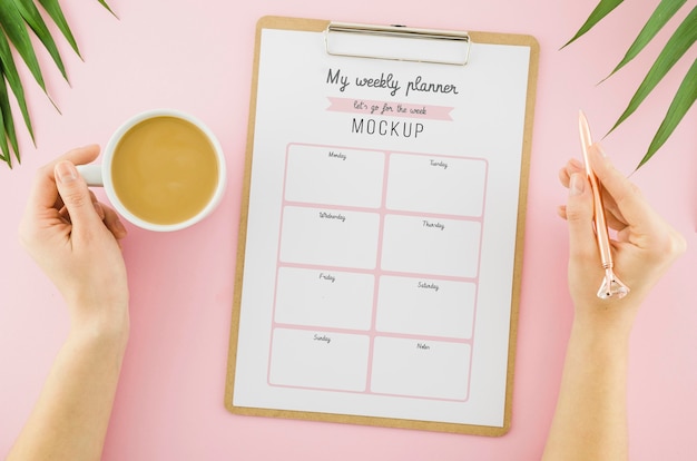 PSD top view weekly planner with coffee