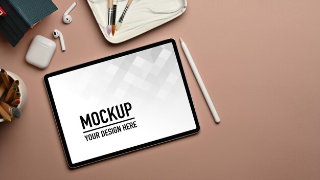 top view of workspace with tablet mockup and accessories
