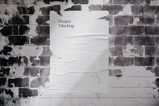 PSD torn poster mockup on brick wall