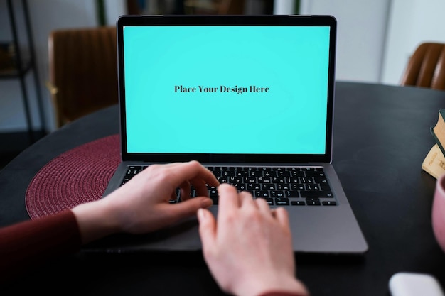 Tosca Green Laptop with White Hand Mockup PSD Customizable Template for Digital and App Design