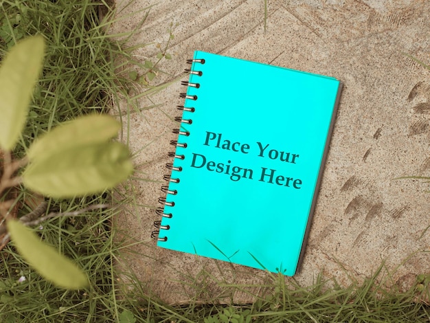 tosca green notebook on wild plants mockup psd