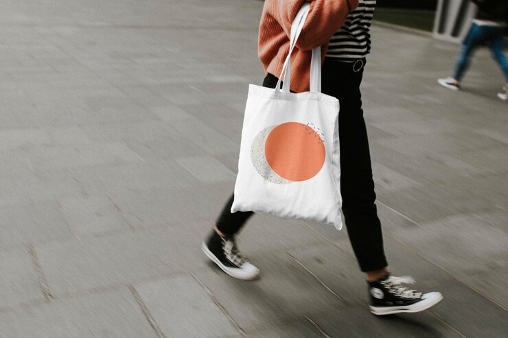 PSD tote bag mockup psd reusable canvas bag carried by a model