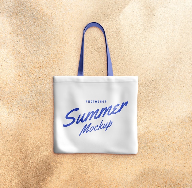 PSD tote bag on sand mockup realistic