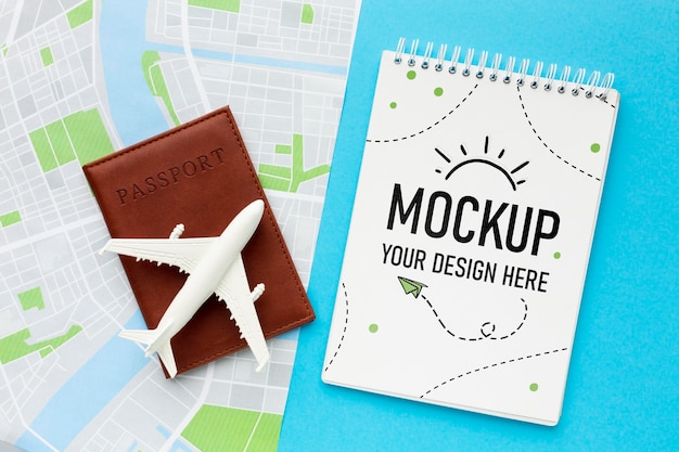 PSD tourist elements arrangement with notepad mock-up