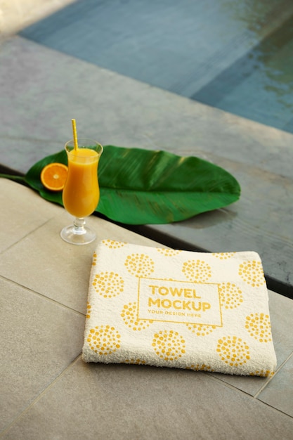 PSD towel mockup by the swimming pool