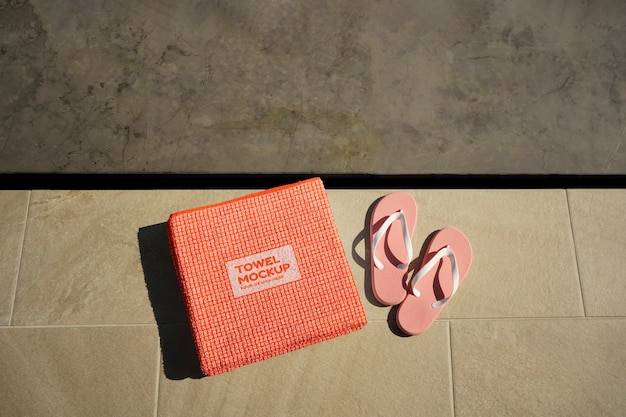 PSD towel mockup by the swimming pool