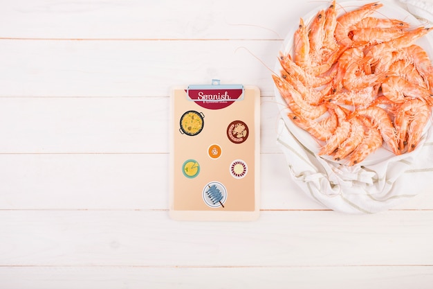 Traditional spanish food mockup with clipboard