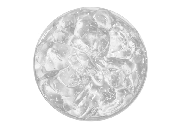 Transparante cosmetische gel in een ronde pot bekijk van bovenaf op een lege achtergrond