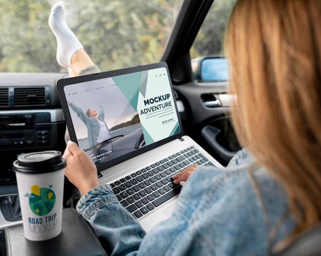 Traveler holding a mock-up laptop