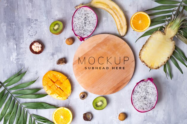 tropical fruits with wooden plate mockup