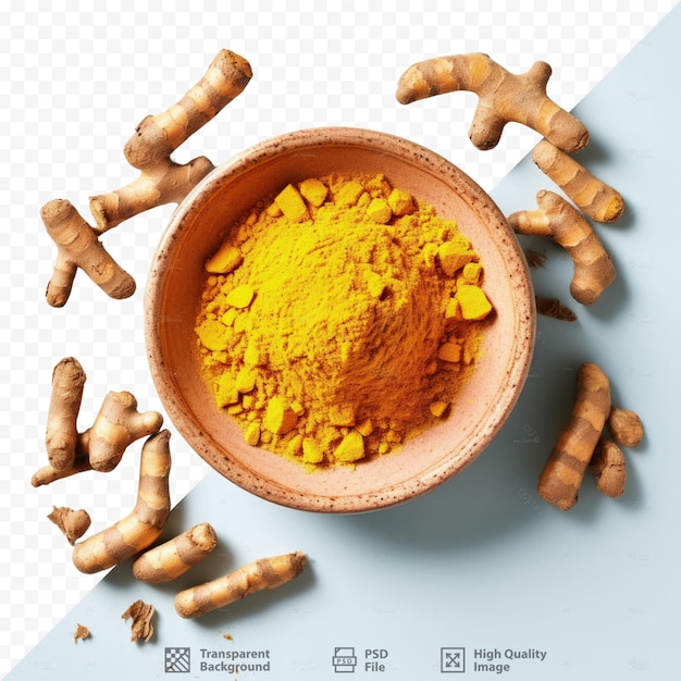 Turmeric roots and powder in a cutout bowl seen from above on a transparent background