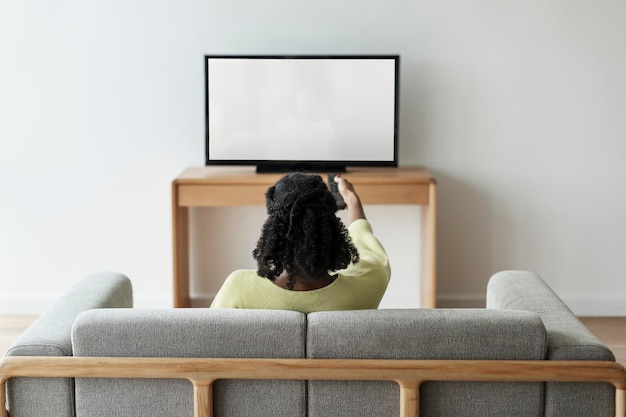 TV mockup woman watching television psd