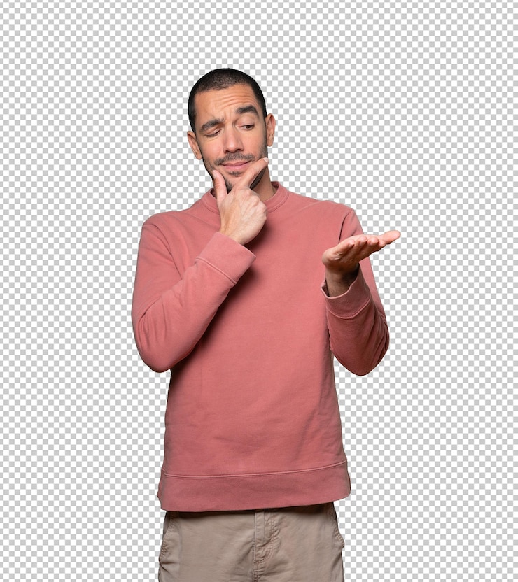 PSD twijfelachtige jonge man die iets vasthoudt met zijn hand