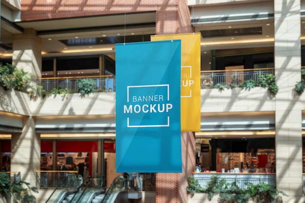 Two banner mockups hanged inside the shopping mall