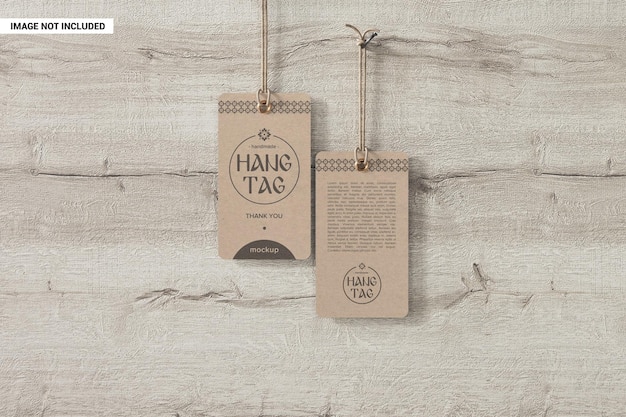 Two kraft clothing hang tags hanging on nails mockup