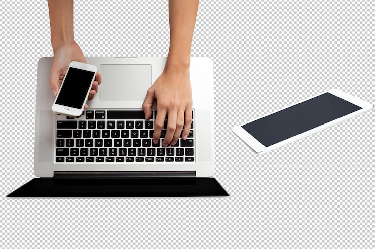 PSD two people are using a laptop and one is typing on a keyboard