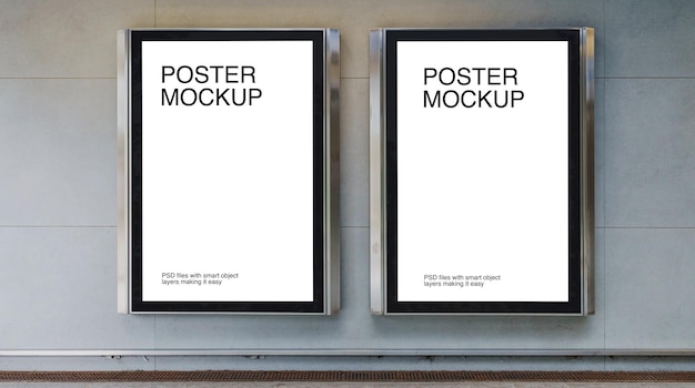 Two posters on a wall with aluminum frame