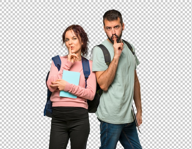 PSD two students with backpacks and books showing a sign of closing mouth and silence gesture