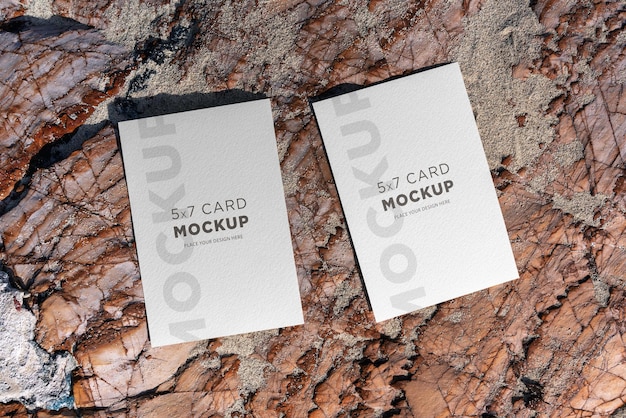 Two white cards 5x7 mockups on a rock