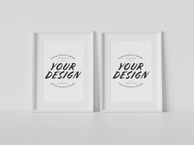 PSD two white frames leaning on floor mockup