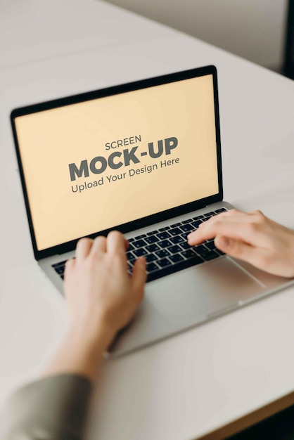 PSD typing mockup laptop screen at indoor home office