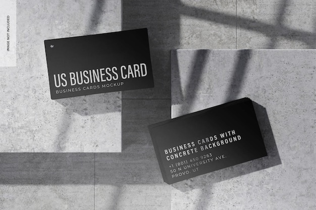 PSD us business cards with concrete background mockup, top view