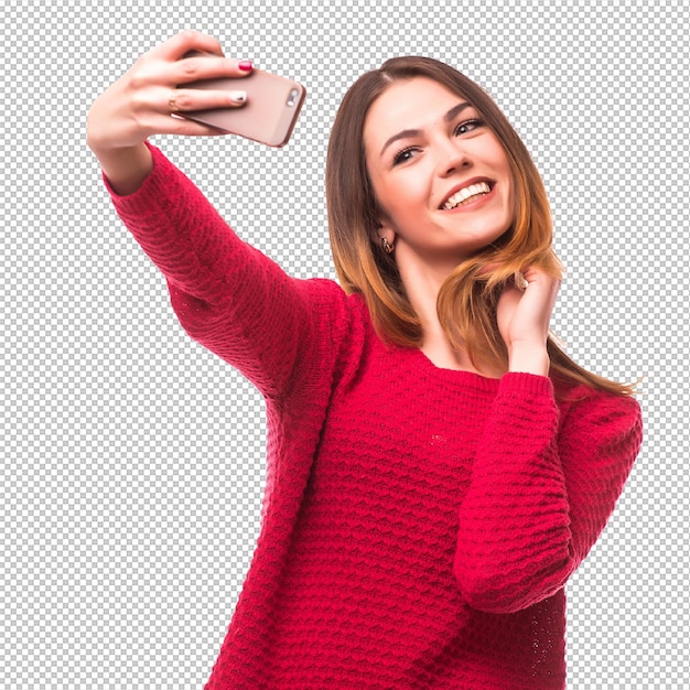Uśmiechnięta młoda dziewczyna robiąca zdjęcie selfie na smartfonie odizolowana nad szarą ścianą