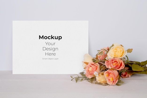 PSD valentine day greeting card mockup empty and flower on wooden table