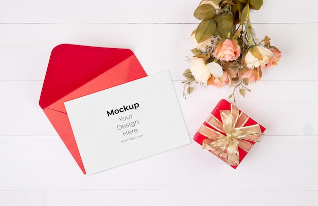 Valentine day greeting card mockup and letter and flower on wooden table 