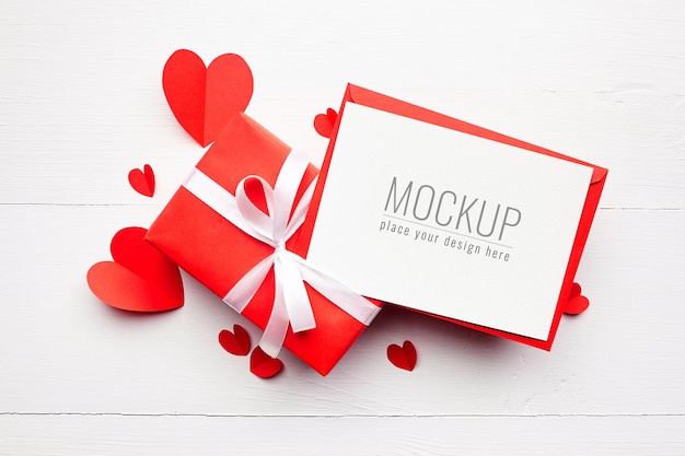 PSD valentine's day card mockup with gift box and red paper hearts