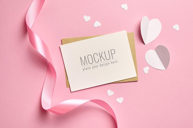 PSD valentines day card mockup with pink ribbon and white paper hearts