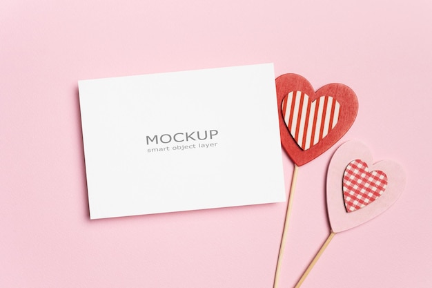 PSD valentines day flat lay with blank paper card mockup with hearts