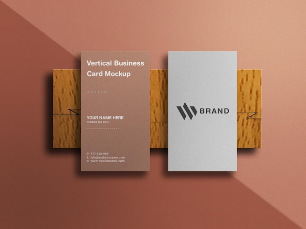 Vertical business card mockup on wood background