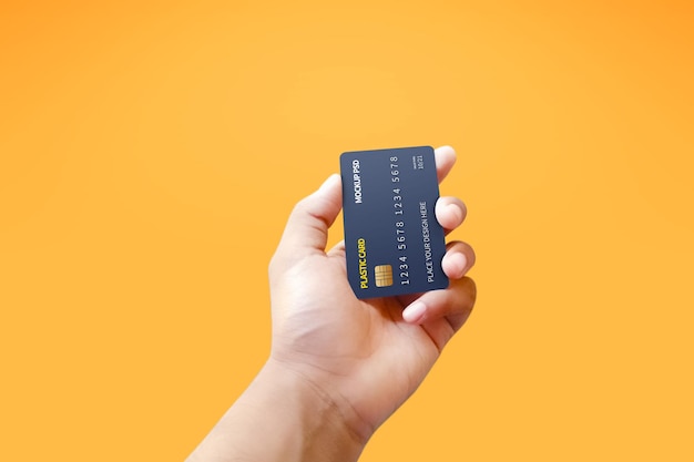 PSD vertical view plastic card in hand mockup