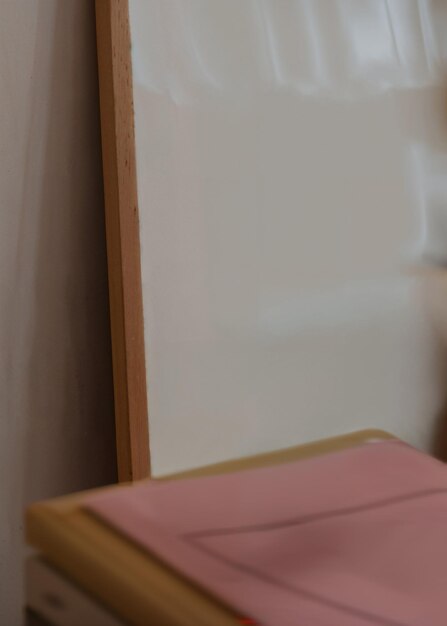 A vertical wooden frame close up mockup with books