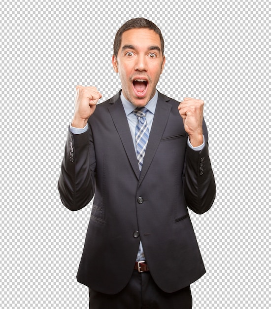 victorious young businessman celebrating