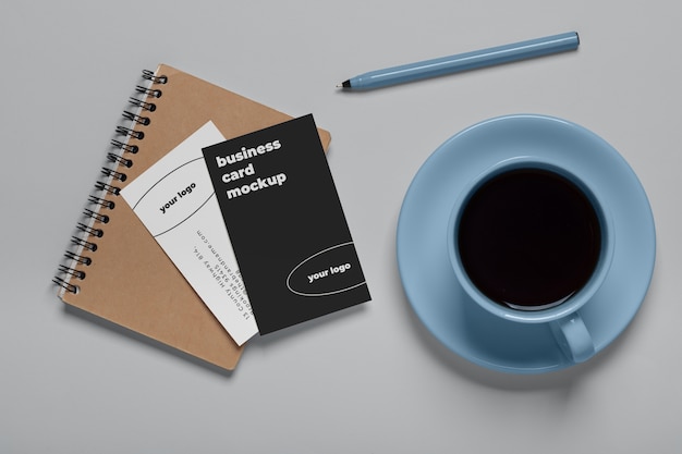 PSD view of coffee cup with professional business card mock-up