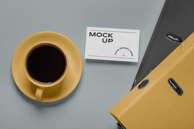 PSD view of coffee cup with professional business card mock-up