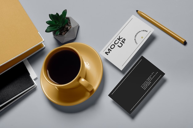 PSD view of coffee cup with professional business card mock-up