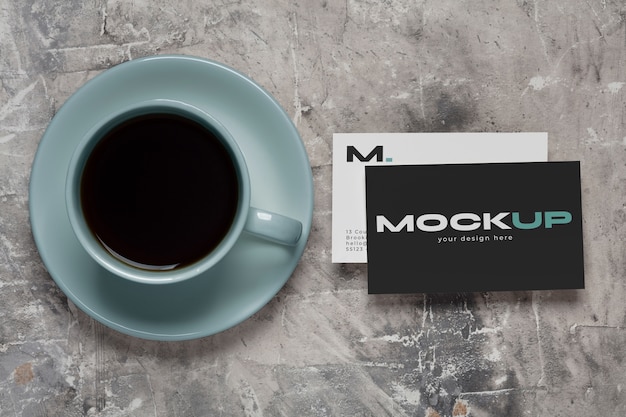 PSD view of coffee cup with professional business card mock-up