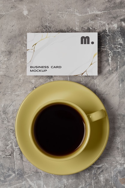 PSD view of coffee cup with professional business card mock-up