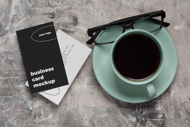 PSD view of coffee cup with professional business card mock-up