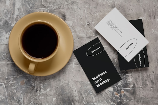 PSD view of coffee cup with professional business card mock-up