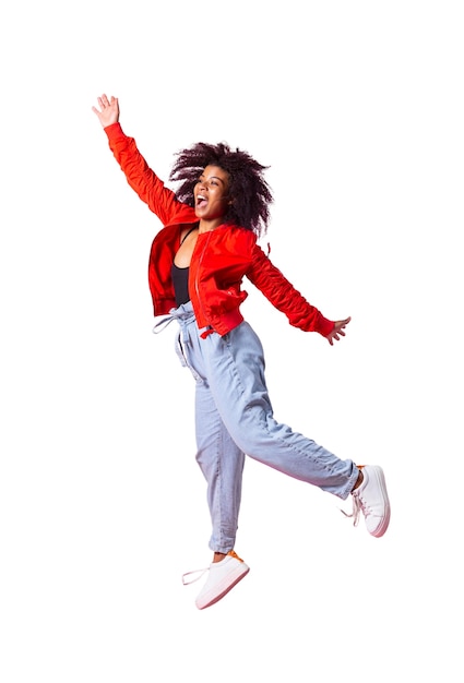 View of happy woman jumping in mid-air