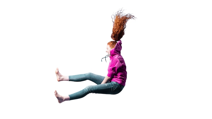 PSD view of happy woman jumping in mid-air