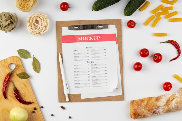 PSD view of paper clipboard mock-up with assortment of food