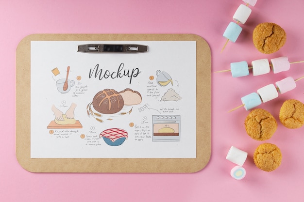 PSD view of paper clipboard mock-up with assortment of food