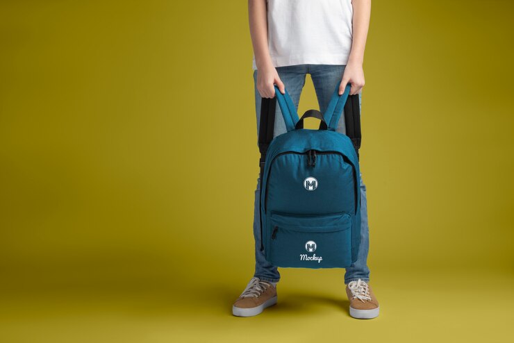 PSD view of person holding backpack mock-up